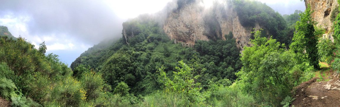 Hiking on the Amalfi Coast Stage 3 green valley with rock and mist below San Lazzaro